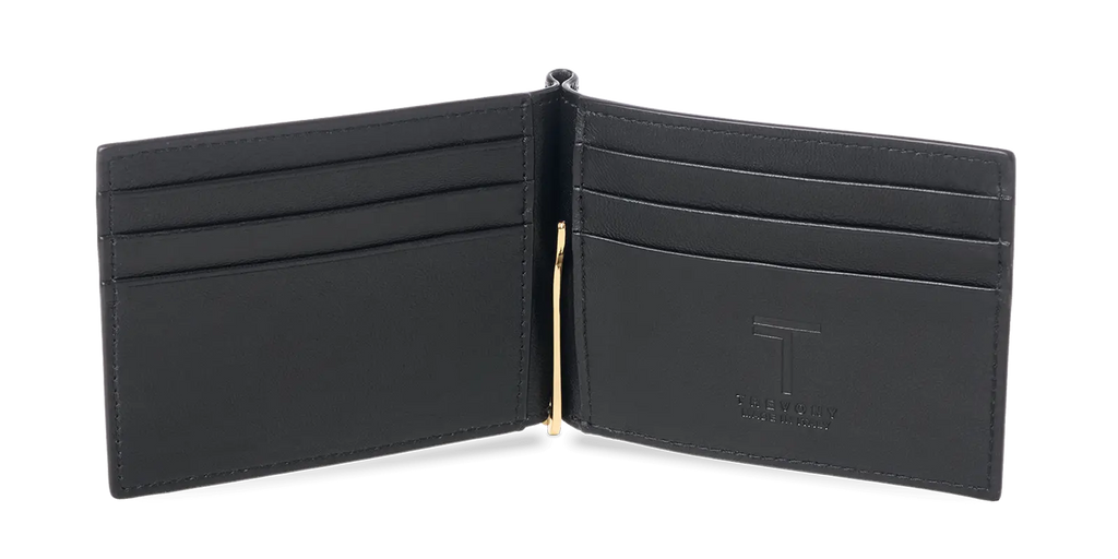 The interior of a black lambskin Trevony Intimo wallet with a gold-tone money clip in the center, multiple card slots on either side, and an embossed brand name.