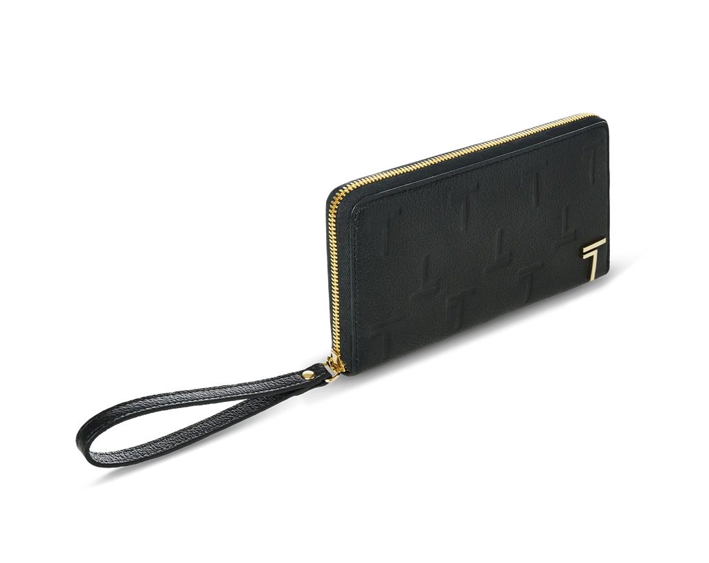 A black lambskin leather zipped wallet with an embossed monogram pattern and a wrist strap, featuring a gold-tone metal logo and hardware from Trevony. 