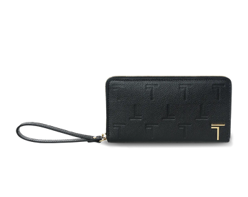 A black lambskin leather long wallet with an embossed monogram pattern and a wrist strap, featuring a gold-tone metal logo and hardware. 
